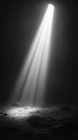 Light rays penetrate darkness creating a serene atmosphere underwater photo