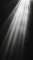 Light rays penetrate darkness creating a serene atmosphere underwater photo