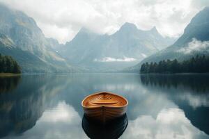 Serene boat on calm lake surrounded by mountains on a misty autumn morning photo