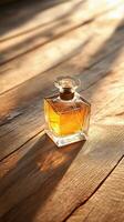 Elegant perfume bottle on wooden table in sunlit room with flowers and soft shadows photo