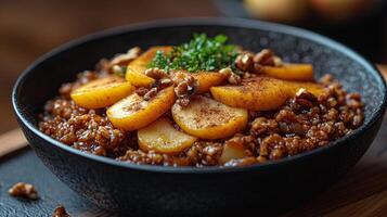 Warm dessert with sauted apples, walnuts, and spices prepared in a rustic kitchen setting photo