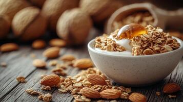 Nutritious oatmeal topped with almonds in a rustic bowl on a wooden table photo