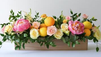 Beautiful floral arrangement with peonies and lemons in a wooden box photo