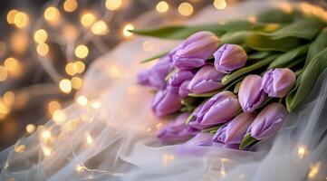 Beautiful bouquet of purple tulips with soft lights in the background during a romantic setting photo