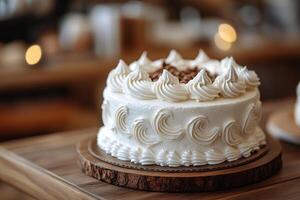 Beautifully decorated white cake on wooden table in cozy kitchen setting photo