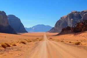 Breathtaking view of a winding desert road in a vast landscape under a bright blue sky photo