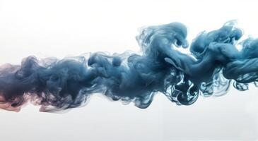 Blue ink swirling in water creating abstract shapes and patterns photo