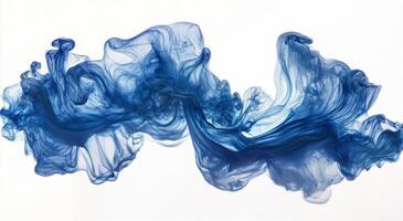 Blue ink swirling in water creating abstract shapes and patterns photo