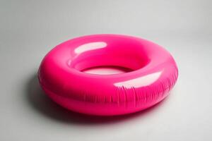 Bright pink inflatable ring designed for summer pool fun and recreational activities photo