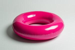 Bright pink inflatable ring designed for summer pool fun and recreational activities photo