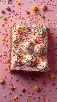Colorful rainbow cake decorated with icing and sprinkles for a festive celebration photo