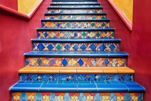 Colorful tiled staircase leading up in a vibrant cultural venue in a city photo