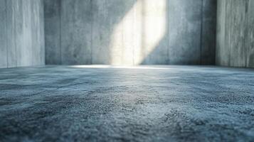 Large empty room with a light shining on the floor. The room is made of concrete and has a very plain appearance photo