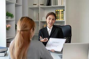 Lawyer discusses contract terms with client in modern office setting professional environment engaging viewpoint photo