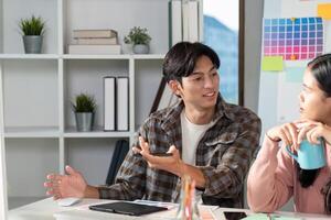 Team meeting on graphic design strategies with color charts modern office collaborative environment engaged viewpoint photo