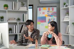 Collaborative design team discussing graphics ideas in modern office space creative environment engaging viewpoint photo