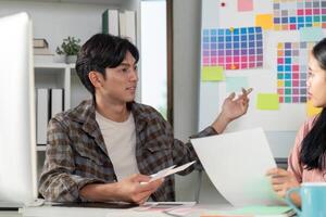 Creative design team discussing graphics strategy in modern office environment for enhanced collaboration photo