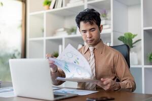 Analyzing business reports office environment document review professional setting close up view insightful analysis photo