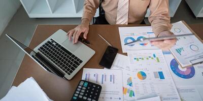 Analyzing financial data office setting business report contemporary workspace overhead view strategic insights for growth photo