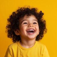 a little boy with curly hair is laughing photo
