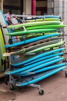 Surf boards in a stack photo