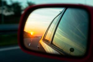 Sunset reflection in the rear view mirror photo