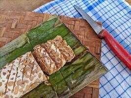 Tempe or tempeh is a typical Indonesian food made from fermented soybeans in addition to yeast or tempeh yeast. photo