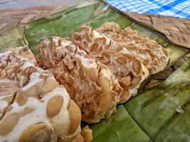 Tempe or tempeh is a typical Indonesian food made from fermented soybeans in addition to yeast or tempeh yeast. photo