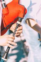 view of the fingers of a bagpiper from Portugal playing the traditional bagpipe photo