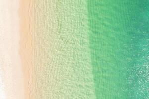 paradisiac beach of turquoise waters from a zenithal drone view. Summer concept background photo