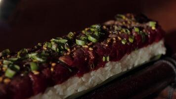 Close up of professional chef using butane torch to sear and heat sushi video