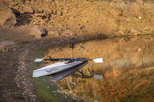 coastal sculling shell in sandstone canyon of Horsetooth Reservoir in Colorado in fall scenery photo