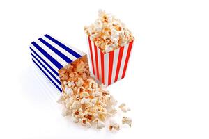 Glass with popcorn on a white background photo