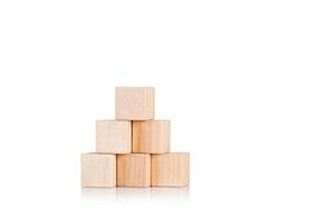 wooden cubes in the form of a pyramid on an isolate white background photo
