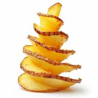 Fried potato spiral stacked in a vertical arrangement on a clean white background. photo