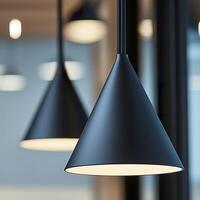 Elegant modern pendant lights with warm illumination in minimalist setting. photo