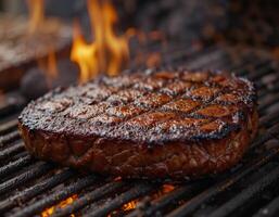 Close-up of a juicy steak sizzling on a charcoal grill. photo