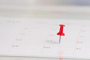 Important dates on a calendar with a red Pin photo