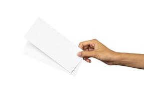 Hand holding blank flight ticket for mockup photo