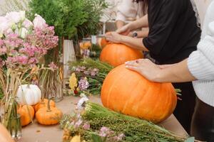 Creating a floral composition in a pumpkin. Making decor with your own hands photo
