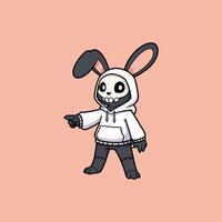 A charming cartoon bunny with a skull head wears a white hoodie and points playfully. vector