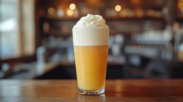 Refreshing creamy beverage served in a tall glass at a casual bar setting photo