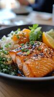 Delicious grilled salmon served with quinoa and fresh vegetable salad on a rustic plate photo