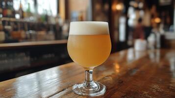 Refreshing craft beer served in a glass at a trendy bar during evening hours photo