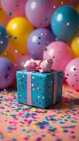 Colorful gift box surrounded by balloons and confetti at a festive celebration photo