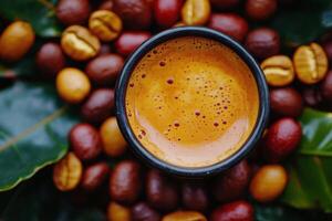 Rich coffee served in a dark cup surrounded by roasted coffee beans on wooden table photo