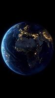 View of Earth from space showcasing city lights and cloud formations at night photo