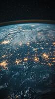 View of Earth from space showcasing city lights and cloud formations at night photo