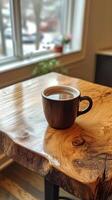 Warm coffee in a cozy setting by the window during a quiet morning photo