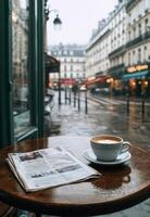 Rainy morning in a Paris cafe with coffee and newspaper on a wooden table photo